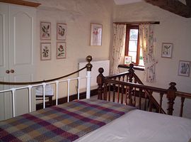 King sized bed in galleried bedroom