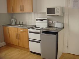 All our flats have fully equipped kitchens .