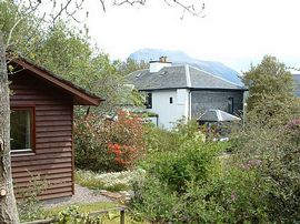 Kilmallie Chalet withthe house and Ben Nevis 