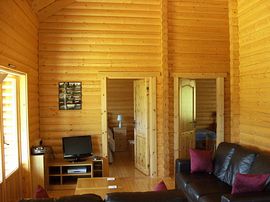 Lounge area with doors leading to bedrooms