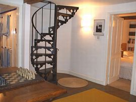 Spiral staircase leading to 1st flr living rm