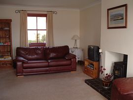  Lounge with wood burning stove   