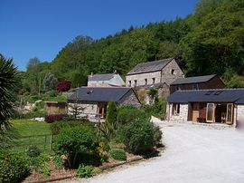 A view of Buttercup and LIttle Toms cottage with the fgrounds of the Mill