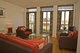 Lounge with French doors to balcony.