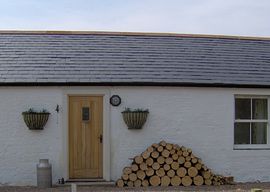 The front door and logs ready to use.