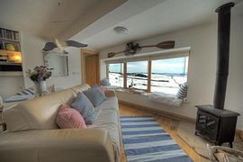 Interior with sofa and wood stove