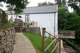 Side elevation with raised balcony by waterfall