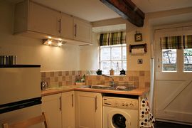 Well-equipped kitchen with dining area.