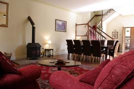 Large dining room with woodburning stove.