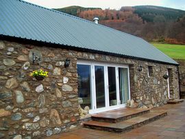 Stone front and patio windows