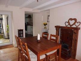 The Dining Room that easily seats four with original feature bread oven