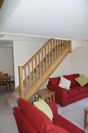 Lounge with stairs to Mezzanine 	 