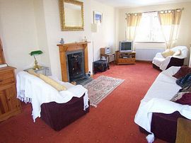 Comfortable Living Room With Cottage Log Burning Stove