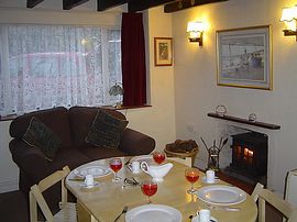 Lounge with table set for dinner